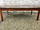 Rosewood coffee 
table with 
tiles and 
massive 
rosewood legs 
and edges. 
Dimensions: 
HxLxB 48x136x75 
cm