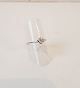 Solitaire ring 
in 14kt white 
gold with 
brilliant-cut 
diamond of 
0,25ct
Stamps: 585 - 
JOKS 
Size 54