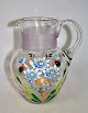 Jug, clear 
glass with 
decorations, 
approx. 1900. 
Germany. 
Decorated with 
flowers in 
enamel and ...