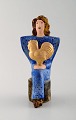 Very rare Lisa 
Larson unique 
figure of 
sitting woman 
in blue with 
golden ...