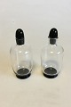 Orrefors Simon 
Gate Two small 
Bottles of 
glass with 
black base and 
cork of black 
glass. Measures 
...