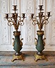 Pair of 1800's 
French 5-armed 
candelabra. The 
base of green 
patinated metal 
is adorned with 
...