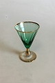 Ida White Wine 
Glass, Green 
with optical 
stripes and 
gold band. 
Measures 13 cm 
/ 5 1/8 in.