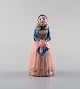 Hjorth 
(Bornholm) 
glazed 
stoneware 
figure, woman 
in national 
costume.
Measures: 10 x 
4.5 ...