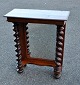 Console, 
Mahogany, 1860 
- 1880, 
Denmark. With 
turned columns 
and mirror. H: 
82 cm. 67 x 32 
cm.