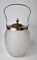 Bisquit bucket, 
approx. 1920. 
Sand blown 
glass. With lid 
and handle in 
nickel-plated 
brass. H: ...