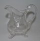 Cream jug in 
clear glass, 
1900, Germany. 
With grindings 
in the form of 
flowers and 
landscapes. ...