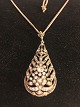 Necklace with 
drop-shaped 
pendant.
with numerous 
brilliant-cut 
diamonds 
grinded the ...