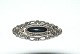 Elegant Silver 
Brooch with 
Onyx
Stamped 925S
Length 5.5 cm.
Height 24.01mm
Nice and well 
...