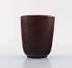 Nils Thorsson 
for Aluminia. 
"Marselis" 
faience vase 
with geometric 
pattern in 
beautiful ox 
blood ...