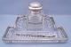 A German 
writing set, 
made in crystal 
set with 
silver. 
Tray: B. 21 
cm. L. 27,5 cm. 

Ink ...