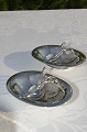 Pair of oval 
salt vessels 
No. 248. 
Saltspoon 110.
Light 
hammer-struck 
silver, handles 
with ...