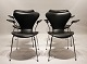 A set of four 
Seven chairs, 
also known as 
model 3207, 
with armrests 
in black 
Savanne leather 
is ...