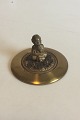 Lid of brass 
with Bacchus 
figurine. By 
Georg 
Thylstrup. 
Measures 10 cm 
/ 3 15/16 in. 
dia.