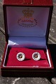 Georg Jensen 
oxeye Daisy 
pair of 
earrings of 
Danish gilt 
sterling silver 
with white 
enamel by ...