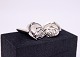A set of 
cuflinks of 830 
silver and 
shaped as 
roses.
2 x 1,5 cm.