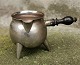 Small sauce pot 
on three legs 
in silver with 
a wooden 
handle. 
Complete 
Copenhagen 
stamp with ...