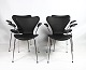 A set of four 
Seven chairs, 
also known as 
model 3207, 
with armrests 
in black 
Savanne leather 
is ...
