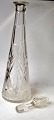 Crystal carafe, 
approx. 1910. 
Conical with 
stopper. With 
grinding. H: 
42.5 cm.
