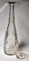 Crystal carafe, 
approx. 1910. 
With stopper. 
With grinding. 
H.: 38 cm.