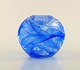 Kosta Boda, 
Sweden. Round 
candle holder 
for tea lights 
in blue art 
glass. Late 
20th century.
In ...