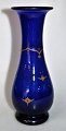 Flower glass, 
cobalt blue, 
Holmegård, 
1853, Denmark. 
Baluster shaped 
on foot, 
smooth. With 
...
