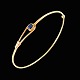 18k Gold Bangle 
with dark blue 
Sapphire.
Stamped with 
750.
Inside dia. 
5,1 x 5,9 cm. / 
2,0 x ...