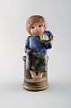 Lisa Larson for 
Gustavsberg. 
Girl with 
flowers in 
glazed 
ceramics. 20th 
century.
Measures: 23 x 
...