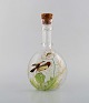 Legras, France. 
Carafe with 
hand painted 
enamel 
decoration
in mouth-blown 
art glass. 
Birds and ...