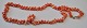 Necklace in 
light red 
coral, approx. 
1900. Length: 
64 cm.
