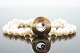 Ole Lynggaard 
gold jewellery. 

Ole Lynggaard; 
Luna clasp of 
14k gold, set 
with a sapphire 
and a ...