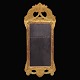 A gilt 
Gustavian 
mirror signed 
Stockholm 
177... 
Sweden circa 
1775
Size: 70x30cm