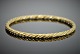 Georg Jensen 
gold jewellery. 

Georg Jensen; 
A braided angle 
of 18k gold 
#1017A. Inner 
diam ...