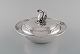 Early and rare 
art nouveau 
Georg Jensen 
lidded bowl in 
hammered 
silver. knob in 
the form of ...