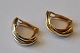 Pair of gold 
ear clips, 20th 
century 10 
carats. 
Stamped. 
Weight: 1.8 
grams.
 
