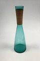 Kastrup 
Glassworks 
Opaline shape 
Green decanter 
with bamboo 
wrapping. Jacob 
E. Bang 1957. 
...