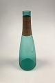 Kastrup 
Glassworks 
Opaline shape 
Green decanter 
with bamboo 
wrapping. Jacob 
E. Bang 1957. 
...