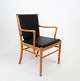 Armchair, model 
PJ-301, in 
cherry wood and 
with cushions 
of black 
leather 
designed by Ole 
...