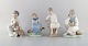 Lladro and Nao, 
Spain. Four 
porcelain 
figurines of 
children. 1980 
/ 90's.
Largest 
measures: ...