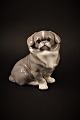 Royal 
Copenhagen 
porcelain 
figurine of 
little 
Pekingese dog.
H: 13.5cm. 
2.sort. 
Decoration ...