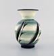 Ilse Claesson 
for Rörstrand. 
Rare vase in 
glazed 
ceramics. 
Leaves on green 
and cream 
colored ...