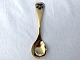 Georg Jensen, 
Spoon of the 
year, 1977, 
Gold-plated 
Sterling 
silver, March 
violet, 15cm 
long * ...