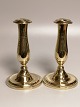 A pair of brass 
tulip poles 
with loose 
cuffs19h. 
Height 18cm. 
Traces of 
age-related 
wear.