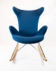 The rocking 
chair in dark 
blue fabric is 
a charming 
example of 
Danish 
furniture 
design from the 
...