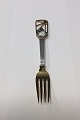 Anton Michelsen 
Christmas fork 
1938. Gilded 
sterling silver 
with enamel.
The artist 
Ebbe ...