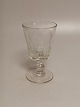 Large 
wellington 
glass with 
inscription and 
dated 1883 
Holmegaard 
glassworks 
Height 16cm.