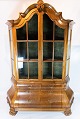 Rococo shaped 
glass cabinet 
of hand 
polished walnut 
by the 
furniture maker 
C. B. Hansen 
from ...