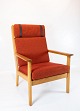 A high armchair 
in oak and red 
wool fabric, 
designed by the 
legendary 
Danish 
furniture 
architect ...