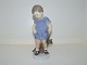 Royal 
Copenhagen 
Figurine, boy 
holding teddy 
bear.
The factory 
mark tell that 
this was ...