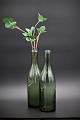 Decorative old 
glass bottle in 
green glass 
with a really 
nice patina in 
the glass 
itself. ...